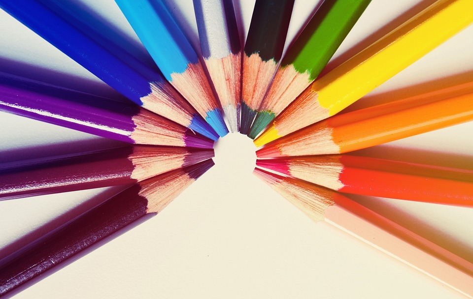 Colored pencils arranged by color to form a rainbow